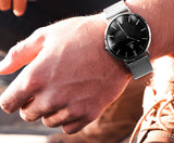 Reloj clásico negro - Color plata y correa metálica